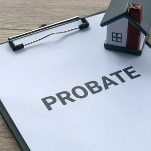 Probate document with house model representing estate property
