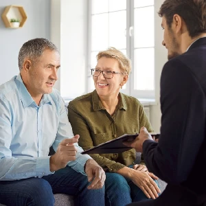 senior couple meeting with attorney estate planning legal documents